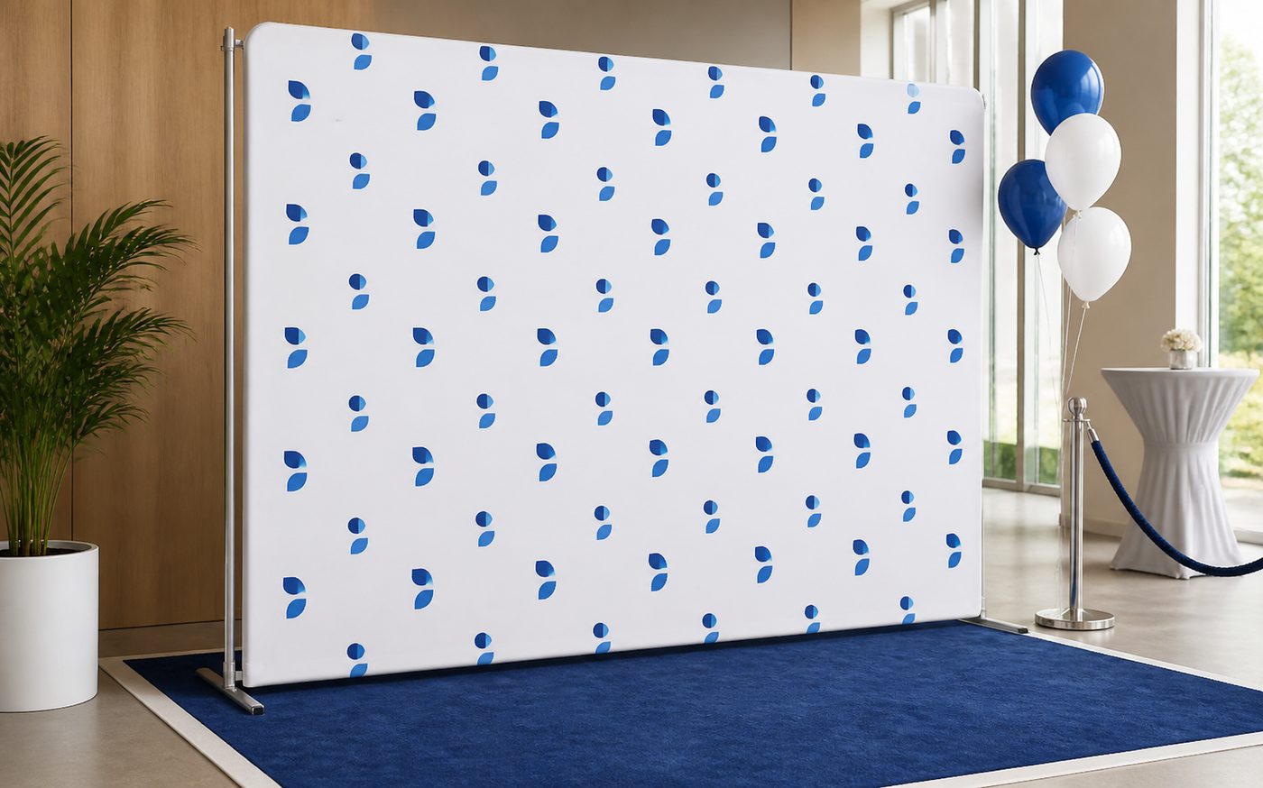 Step and repeat backdrop display with clean blue and white event graphics