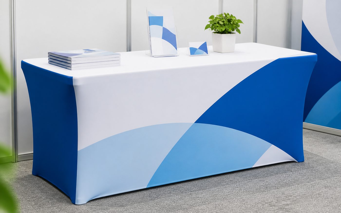 Custom fitted table cover with clean blue and white event display graphics